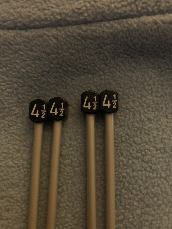 Two pairs of 4½ mm straight knitting needles