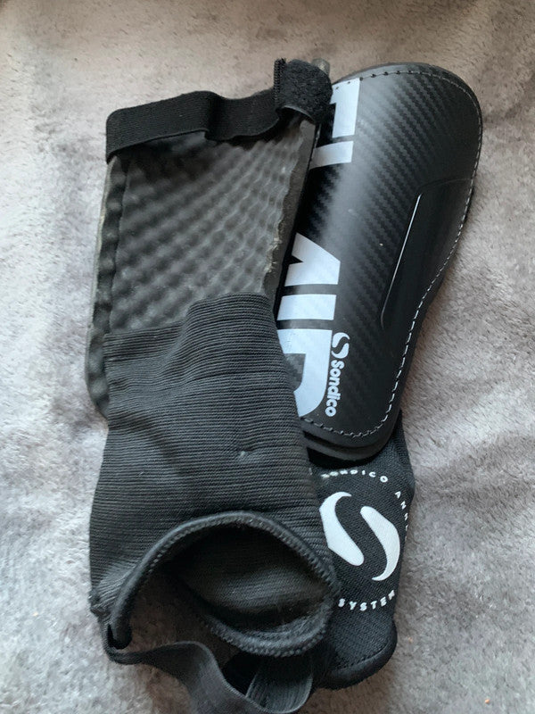 football (soccer) shin guards with ankle support.