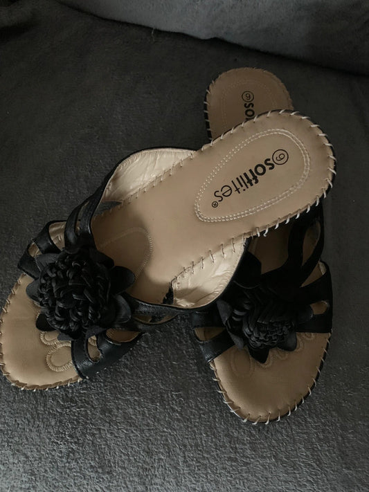 Softlites black wedge sandals with a woven flower detail on the front.