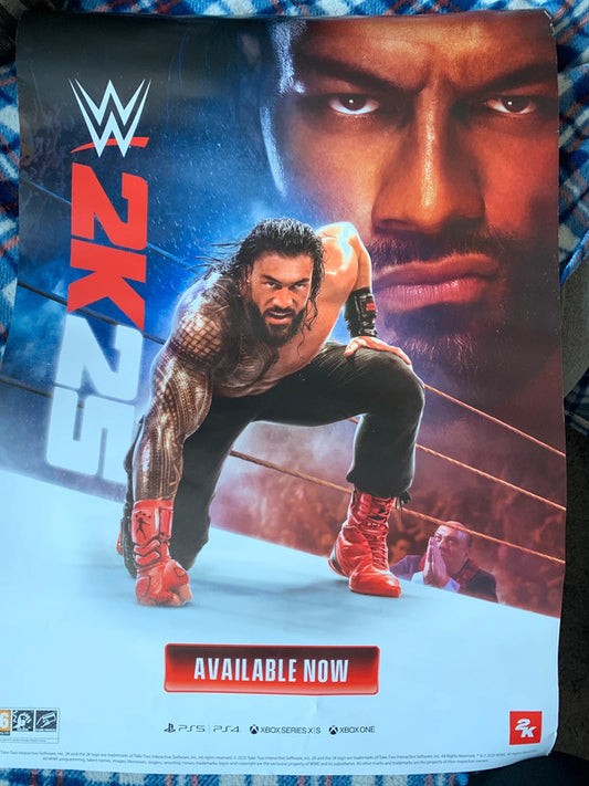 WWE 2K23 promotional poster featuring Roman Reigns (with Paul Heyman in the background).